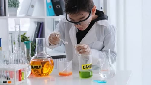 Child Doing Science Experiment in Lab
