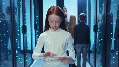 Girl with Tablet in Futuristic Server Room