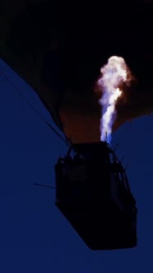 Hot Air Balloon with Flames at Night