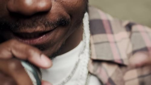 Black Mans Lower Part of Face Rapping in Microphone