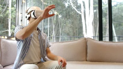 Young Adult Using Virtual Reality Headset at Home