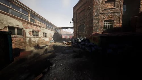 Abandoned Factory with Collapsing Brick Buildings and Overgrown Surroundings