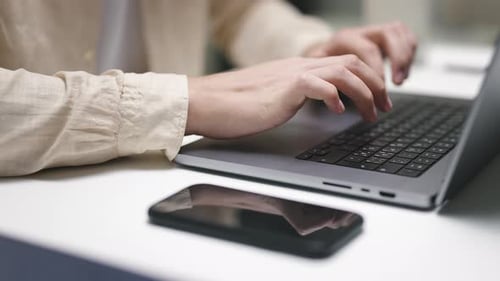 Close Up of Man Hands Working Using Keyboard of Computer Laptop