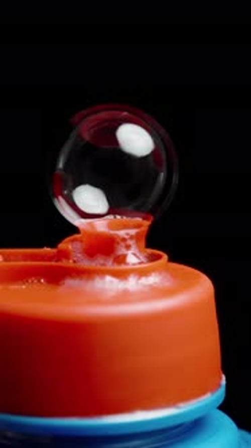 Soap Bubble Forms then Pops on Dispenser