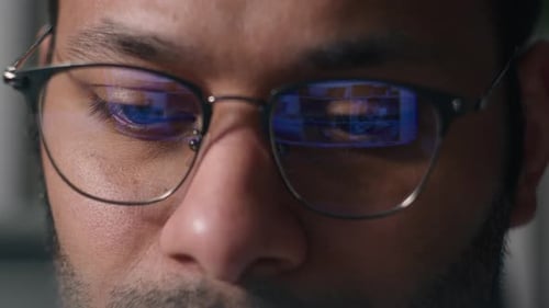 Close Up Male Eyes in Eyeglasses Laptop Monitor Light Programming Codding Cyberspace Man Businessman