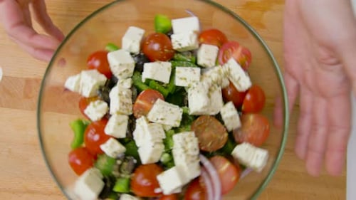 Colorful salad with tomatoes, cheese, peppers, olives