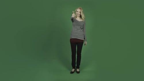 caucasian woman isolated on chroma green screen background smiling thumbs up