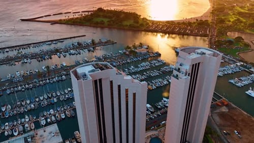 Two similar beautiful buildings on the shore of Waikiki, Honolulu, Hawaii, USA.