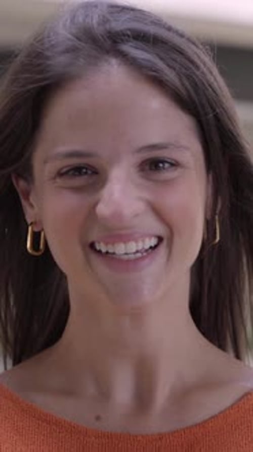 Vertical Outdoor Video of a Young Smiling and Cheerful Caucasian Woman