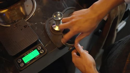 4K Barista making hot coffee on coffee maker at coffee shop.