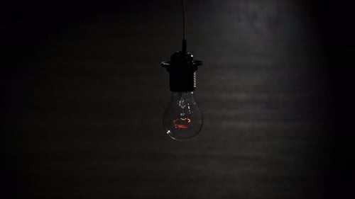 Vintage Light Bulb Flickering in the Dark