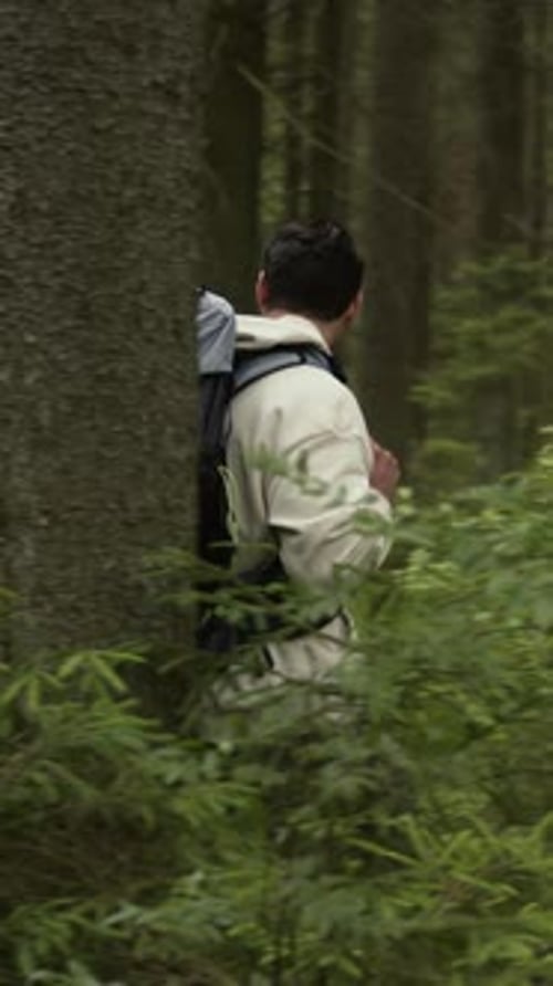 Couple of Tourists Exploring Forest Trails during Hiking Trip
