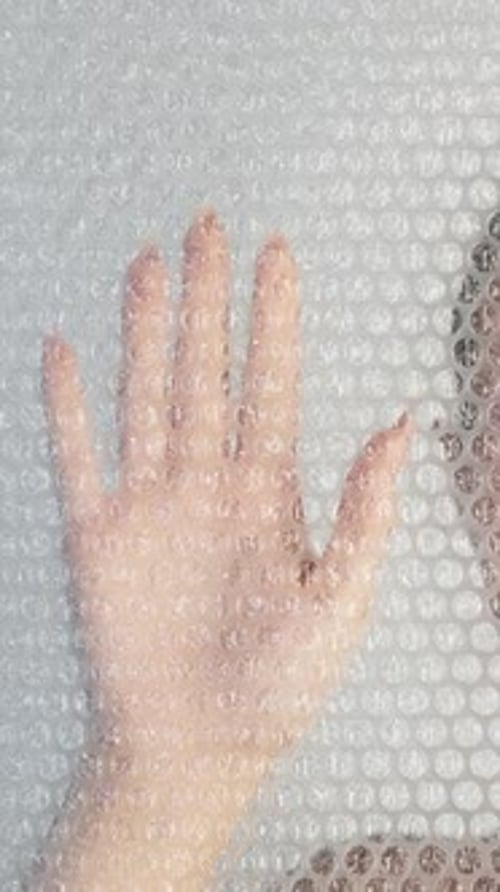 Vertical Plastic Contamination Woman Hand Wrap