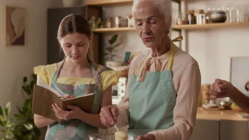 Grandmother, Mother and Daughter Baking in the Kitchen