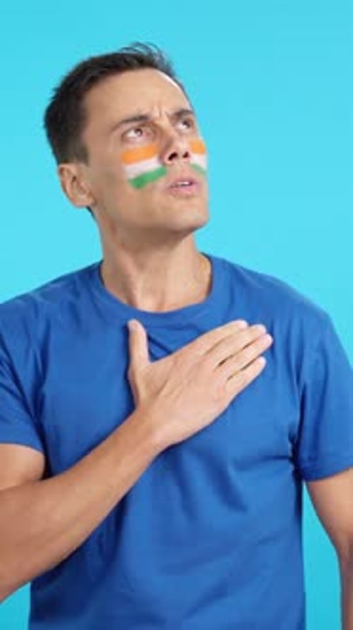 Man with Flag on Face Pledging Allegiance