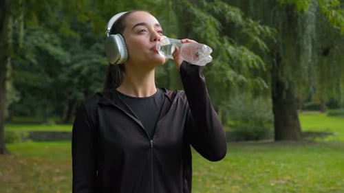 Happy Beautiful Caucasian Woman Fitness Girl Smile in City Park Sport Outdoors Female Listening