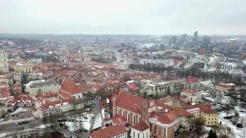 Aerial show flying above the old town of Vilnius, Lithuania on a winter morning