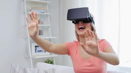 Excited Woman Experiencing Virtual Reality Headset at Home
