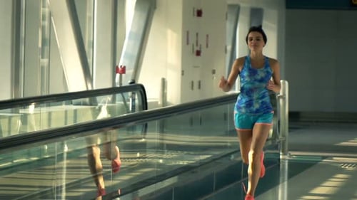 Woman Jogging In Tunnel In City, Super Slow Motion 240fps