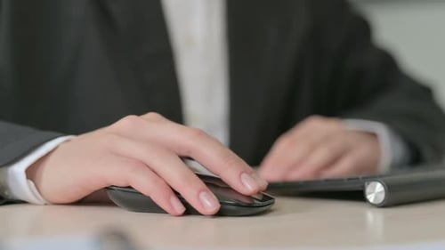 Close Up of Young Businesswoman Using Computer Mouse