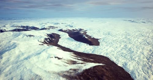 Majestic Snow Covered Landscape with a Winding River and Mountains in View