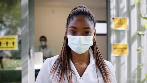 Woman Wearing Mask in Clinic Environment