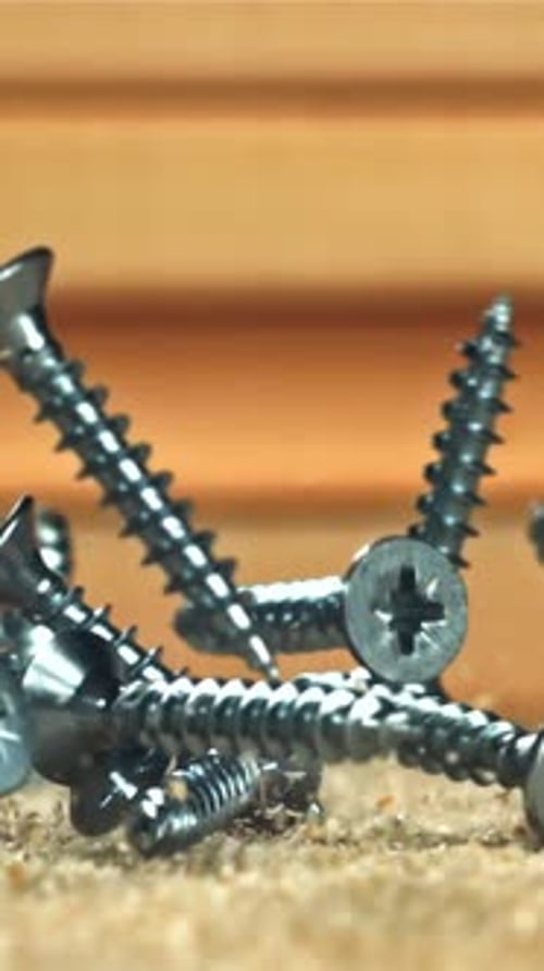 Selftapping Screws Fall on a Wooden Surface Filmed on a Highspeed Camera at 1000 Fps