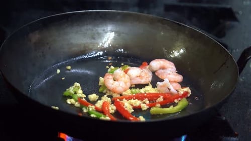 Cooking Shrimp Stir Fry in Wok Close Up