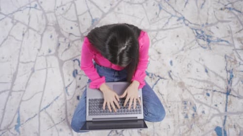 Happy and positive young woman using laptop and rejoicing. Passionately rejoicing woman.