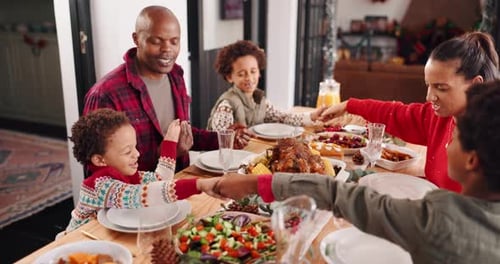 Family Celebrates Christmas Dinner Together at Home