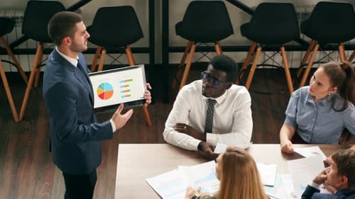 Business Team Discussing Data During Meeting