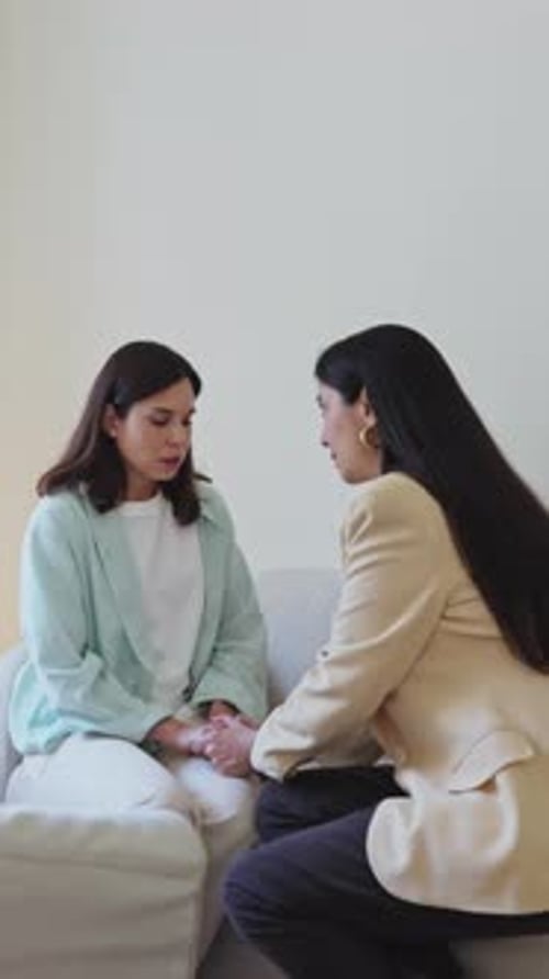 Psychologist Supporting Her Young Patient During Therapy Session