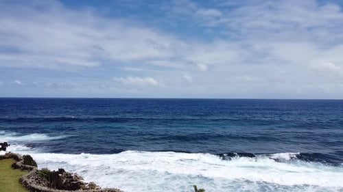 Deep blue sea palm tree reveal shot in Philippines