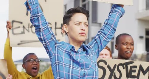 Group of People Protesting and Chanting in Neighborhood