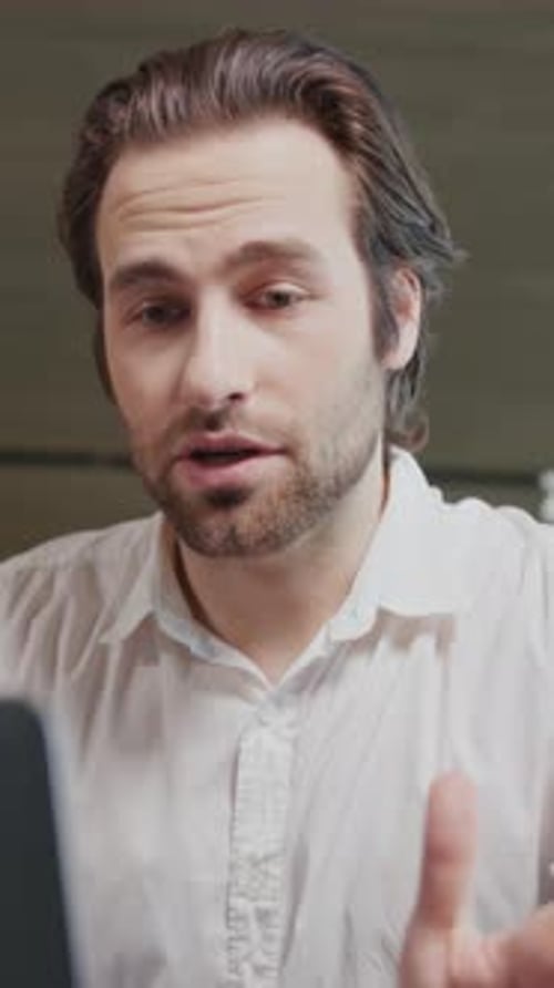 Close Up Attractive Young Business Man Talking in Video Conference Using Laptop Sitting Working