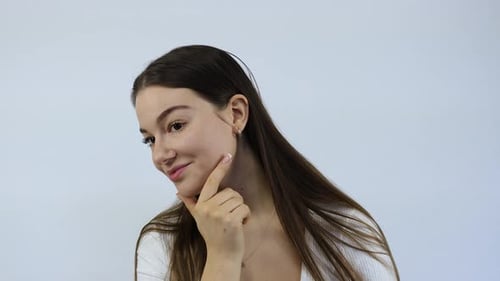 Attractive Woman Touching Her Face in Close Up