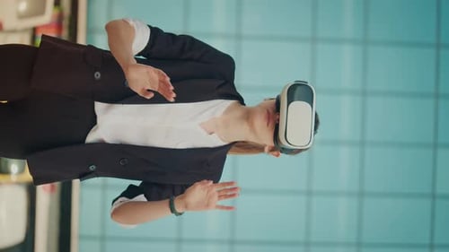 Vertical Video Woman Engineer Wearing Virtual Reality Headset Works and Gestures