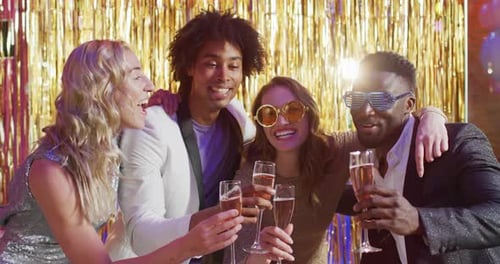 Happy Friends Toasting Champagne at Celebration Event