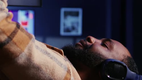 Vertical Video Host in Dimly Lit Studio Filming Internet Show Panning Shot