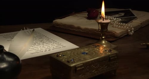 Candlelight and antique desk with vintage objects