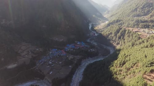 Aerial View of a Serene Village Nestled in the Mountains of Nepal Showcasing Traditional