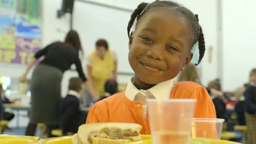 CU A girl enjoying in school canteen
