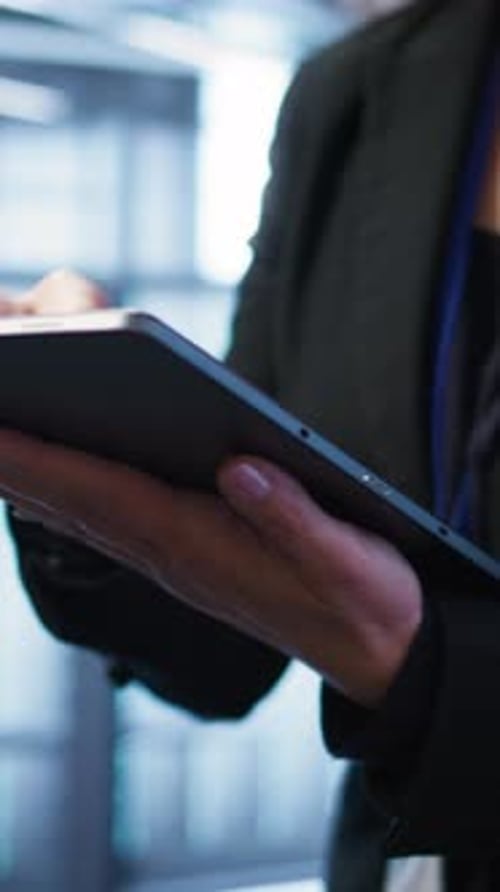 Vertical Video Close Up Shot of Person in Server Room Optimizing Data Center Gear