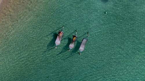 Relaxing on Beautiful Bamboo Loungers in Crystal Clear Waters of Koh Kood Thailand