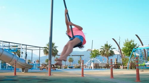 Children Play on Rope Swing at Beach Playground