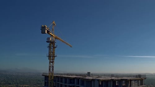 Cinematic Aerial Clip New City Construction Site with Large Industrial Lifting Tower Crane Building