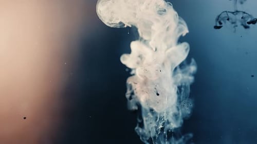 Falling magical Nebula powder in slow motion underwater,close up