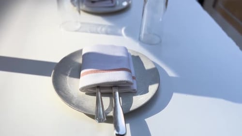 Elegant Table Setting with Cutlery and Napkin