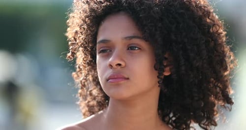 Beautiful preteen girl child portrait smiling outside, black African descent