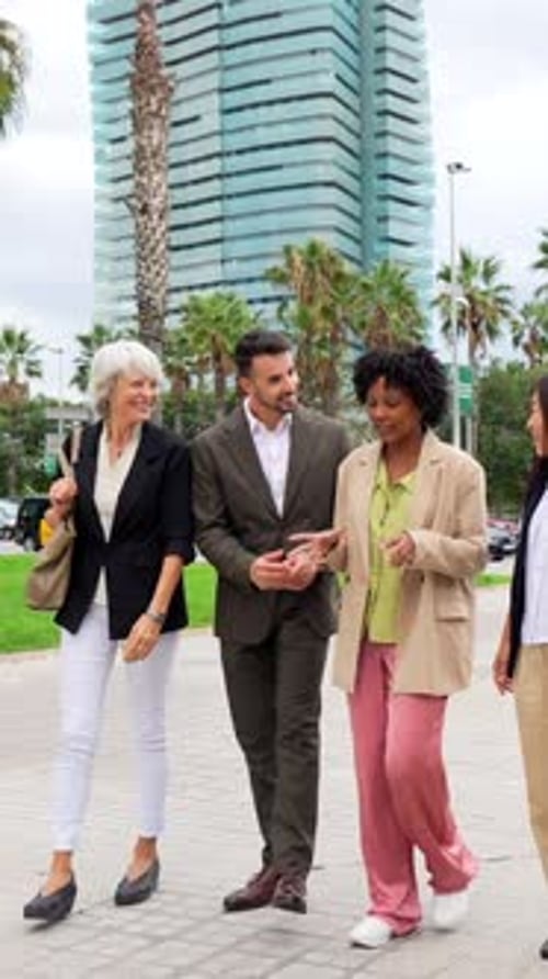 Multiethnic Group of Business People Walking Talking Along the City